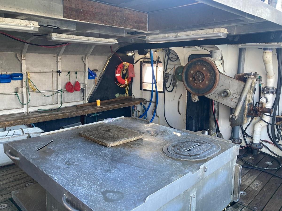a large metal machine aboard 1979 CUSTOM LONGLINE/TENDER/CRABBER Yacht for Sale
