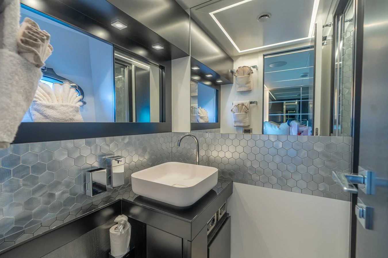 a bathroom with a large mirror aboard VINTAGE Yacht for Sale