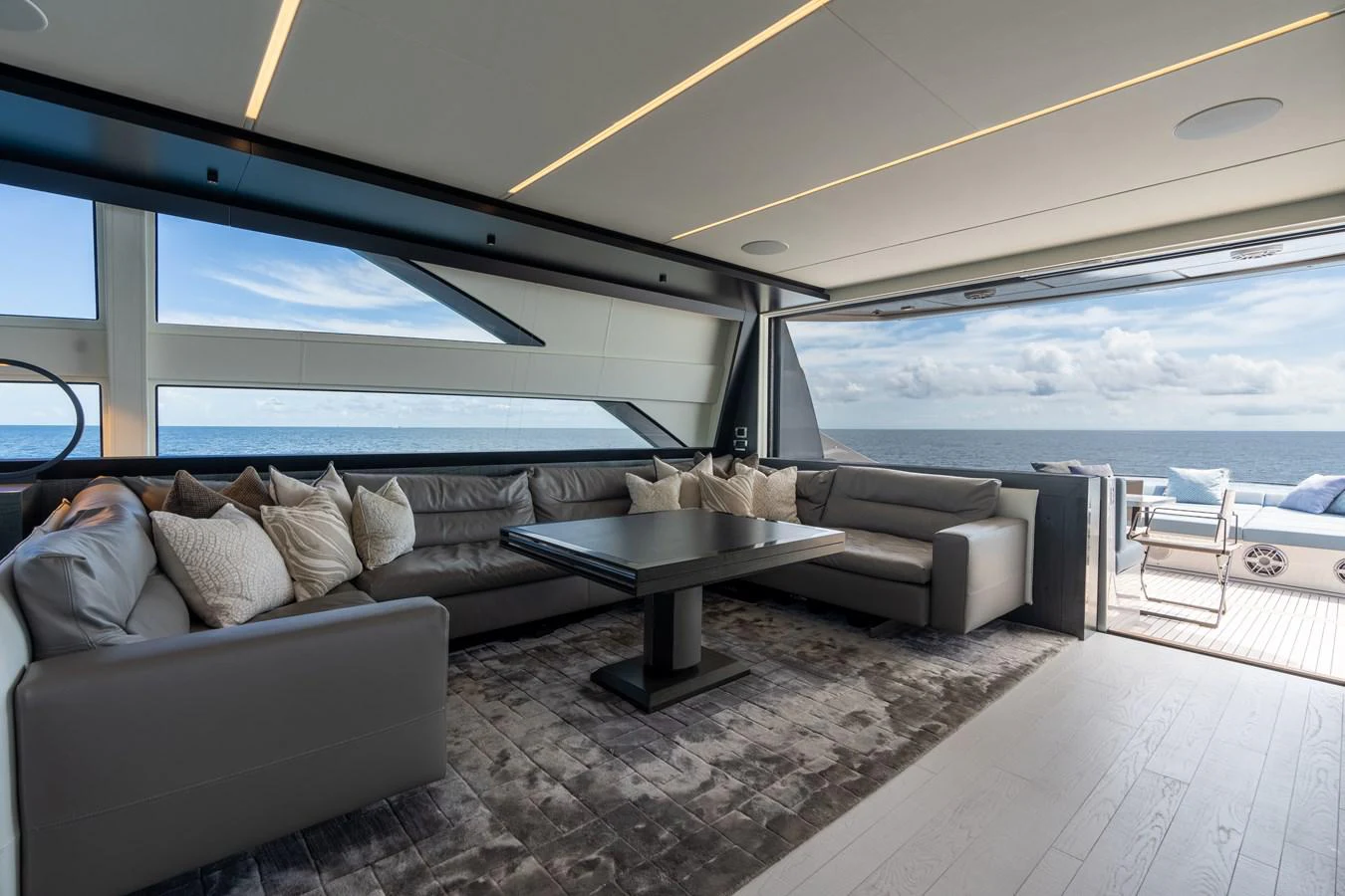 a living room with a large window aboard VINTAGE Yacht for Sale