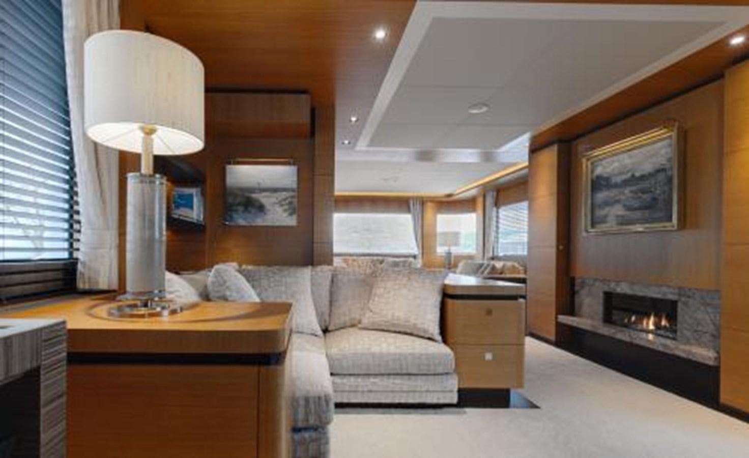 a living room with a fireplace aboard BDJ Yacht for Sale