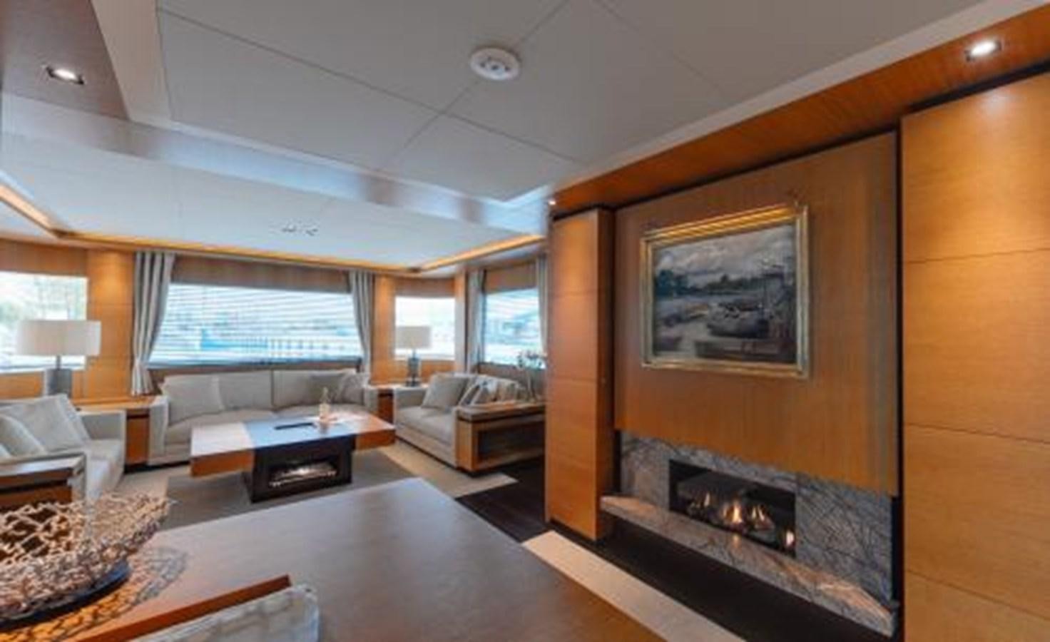 a living room with a fireplace aboard BDJ Yacht for Sale