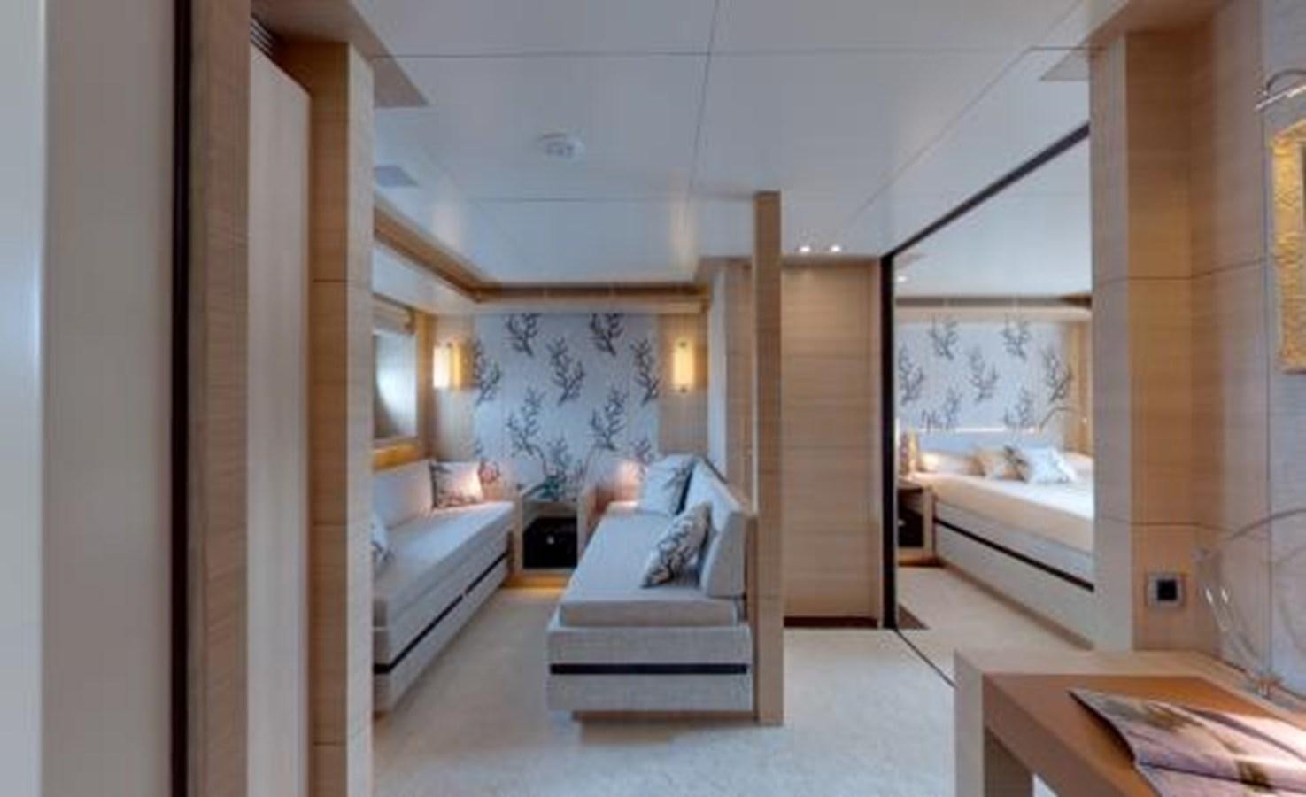 a room with a couch and a bed aboard BDJ Yacht for Sale