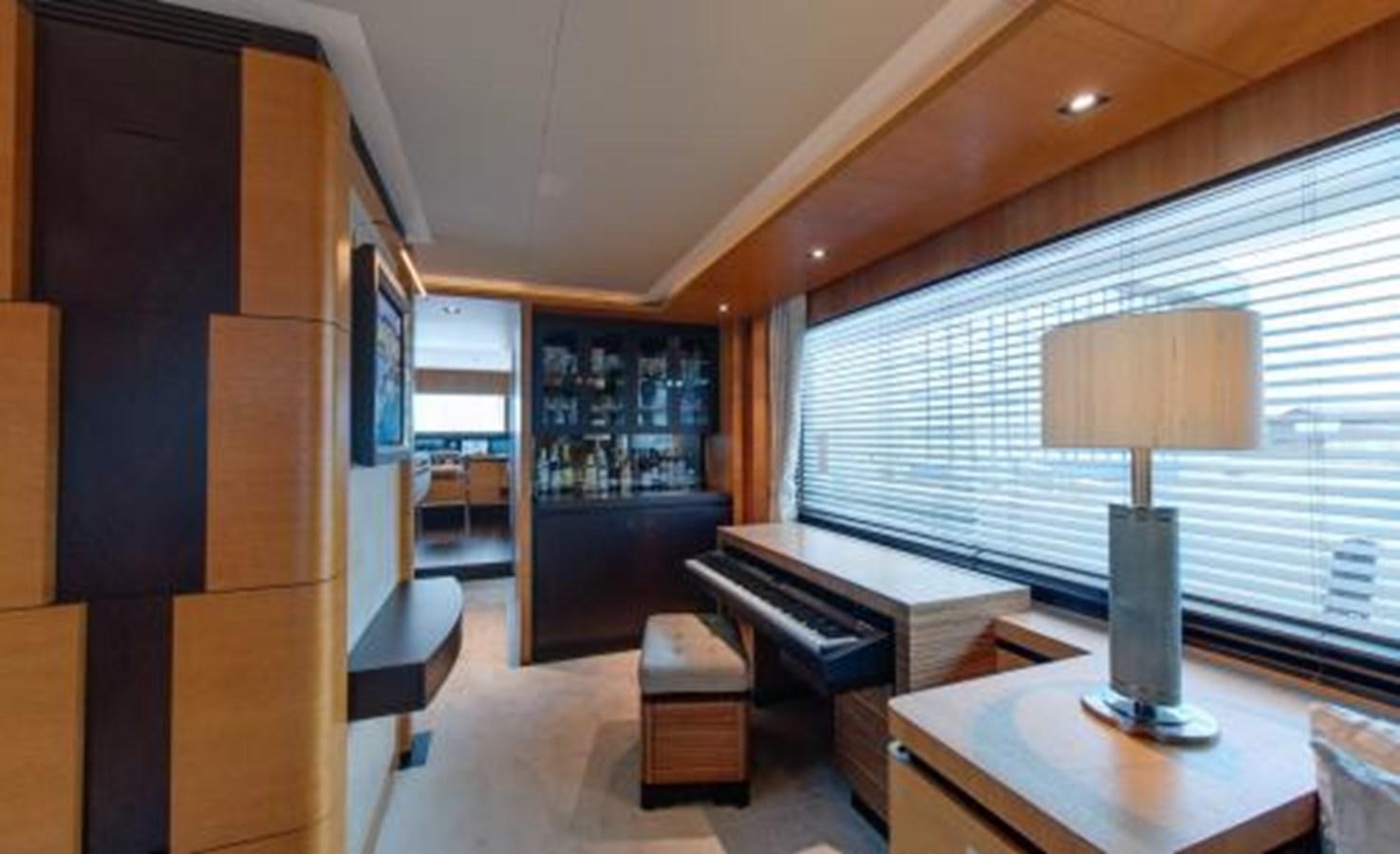 a room with a lamp and a table aboard BDJ Yacht for Sale