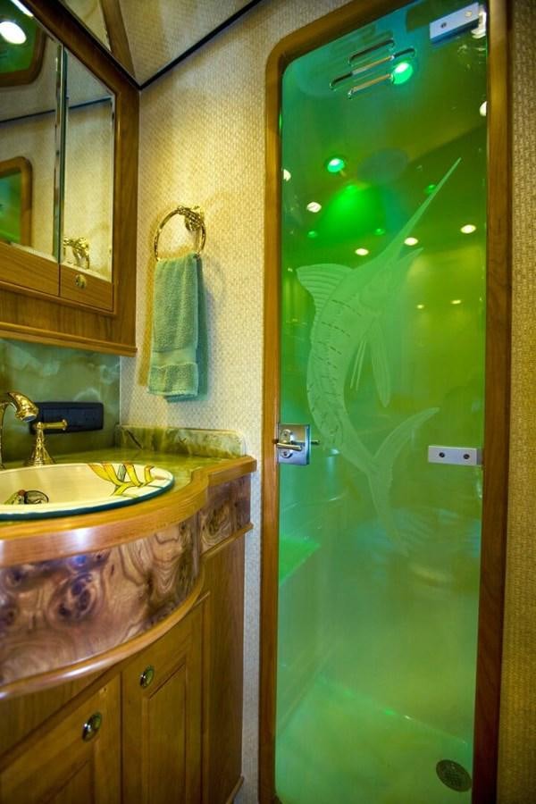 a bathroom with a green door aboard ANN WARRICK Yacht for Sale