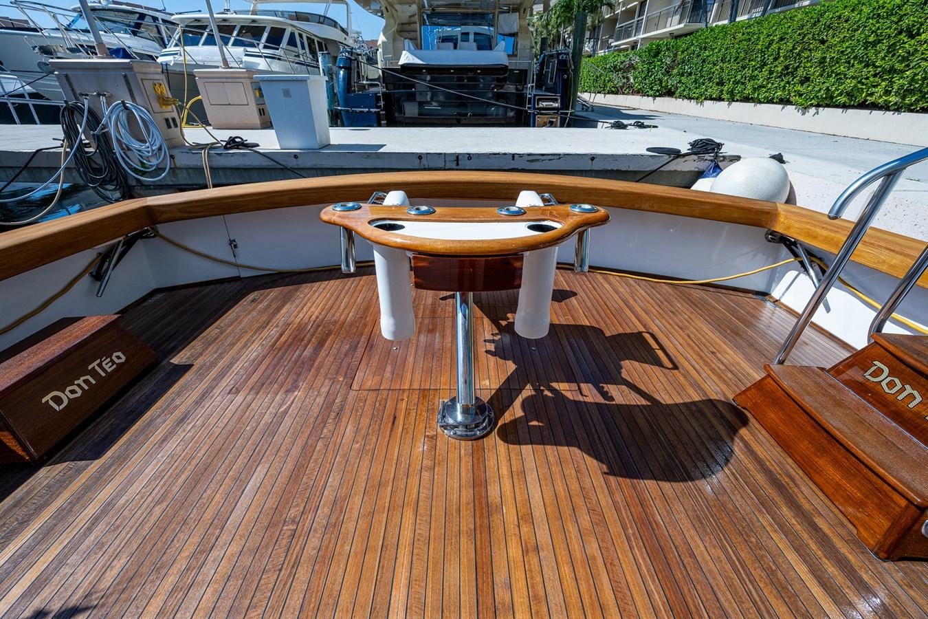 a wooden table with a wood frame aboard DON TEO Yacht for Sale