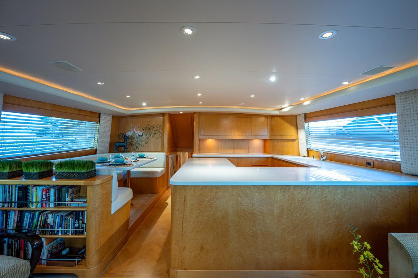 a room with a large window and a bookcase aboard DON TEO Yacht for Sale