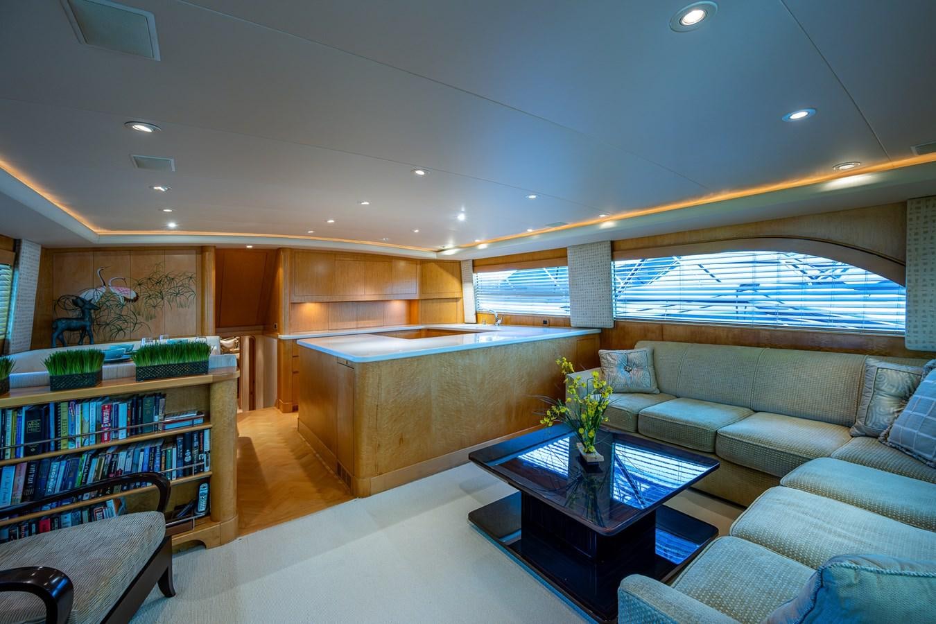 a living room with a couch and a coffee table aboard DON TEO Yacht for Sale