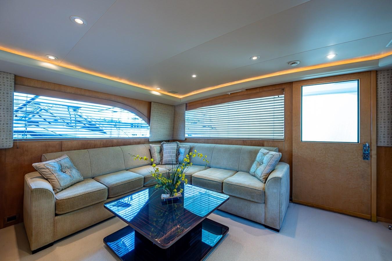 a living room with a couch and a coffee table aboard DON TEO Yacht for Sale