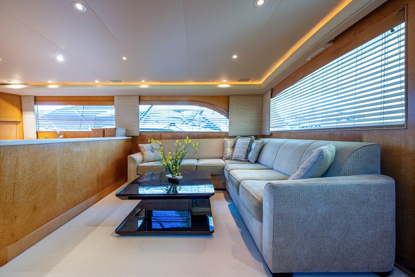 a living room with a couch and a coffee table aboard DON TEO Yacht for Sale