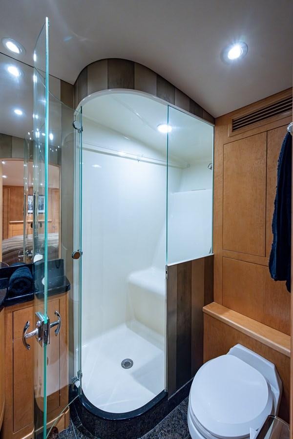 a bathroom with a glass shower aboard DON TEO Yacht for Sale