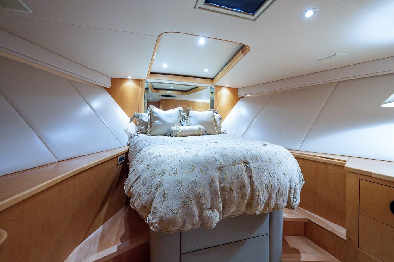 a couple of cats lying on a bed in a room aboard DON TEO Yacht for Sale