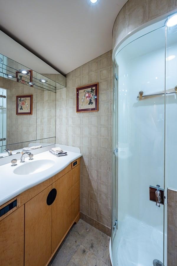 a bathroom with a shower and sink aboard DON TEO Yacht for Sale