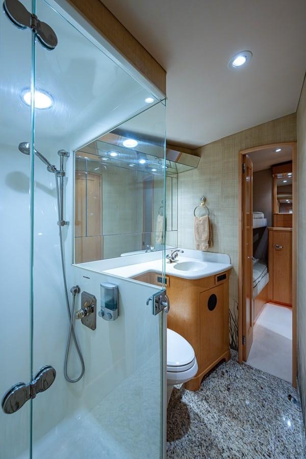 a bathroom with a glass shower door aboard DON TEO Yacht for Sale