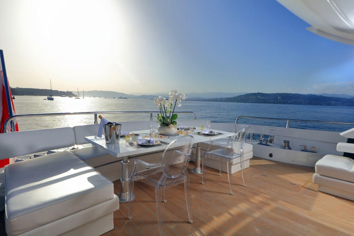 a table on a boat aboard BAIA 100 Yacht for Sale