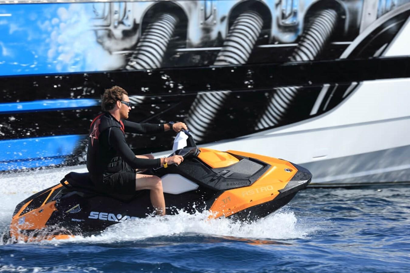 a couple of men on a jet ski aboard BAIA 100 Yacht for Sale