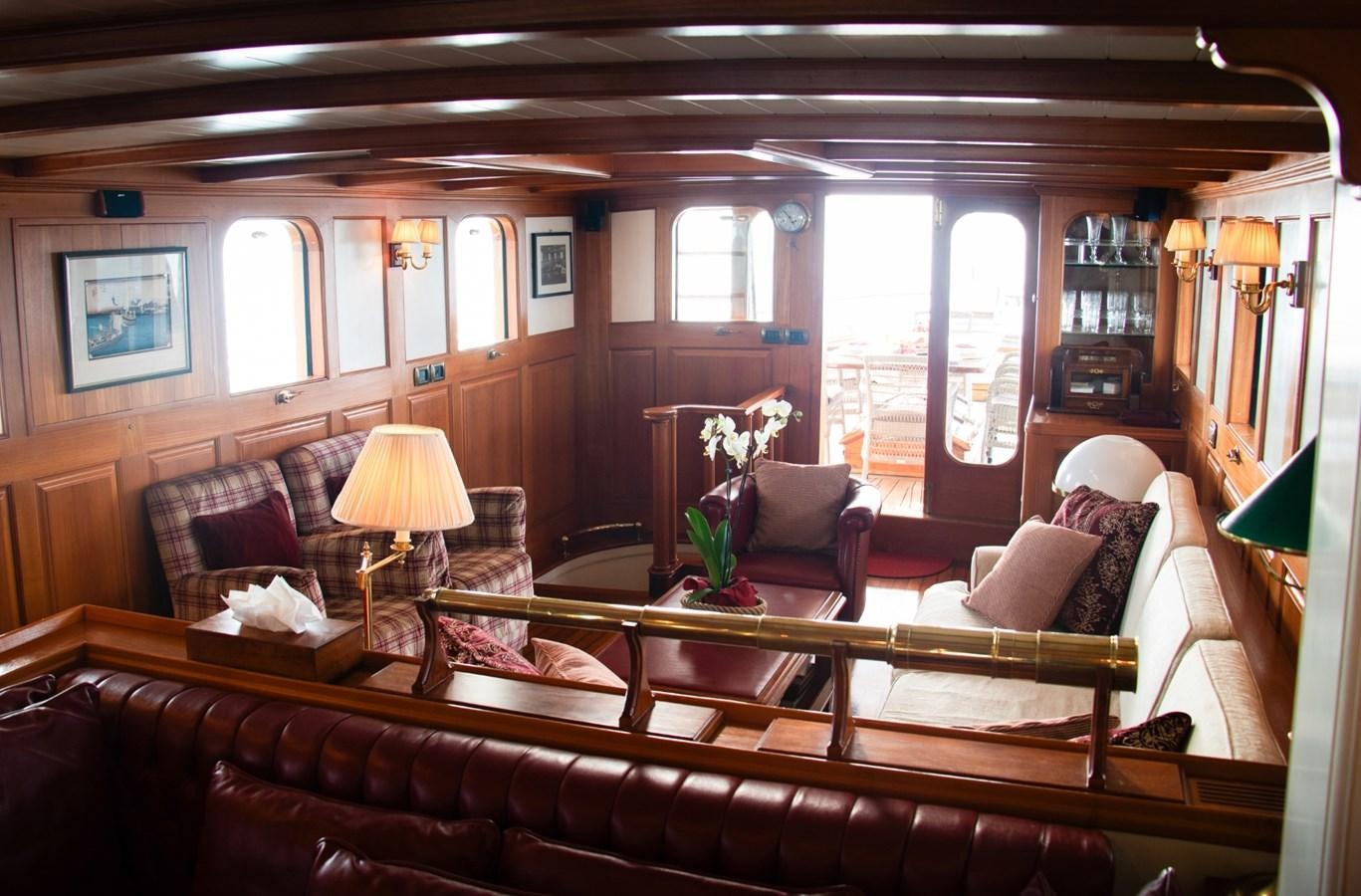 a living room with a large window aboard LADY HERTHA Yacht for Sale