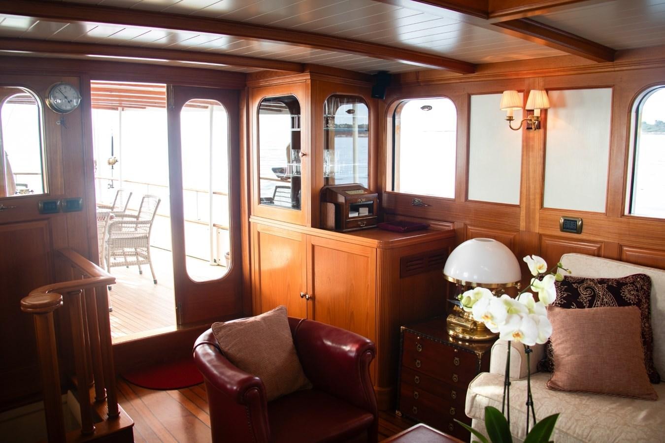 a living room with a couch and a table aboard LADY HERTHA Yacht for Sale