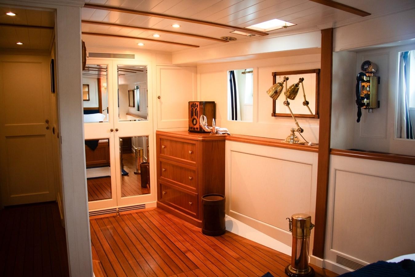 a room with a wood floor and a mirror aboard LADY HERTHA Yacht for Sale