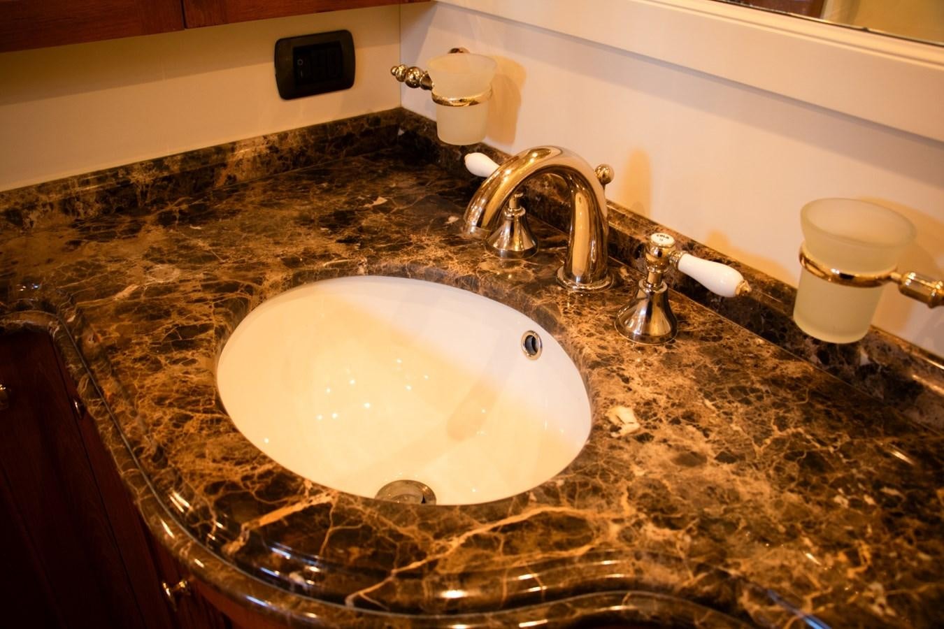 a bathroom sink with a large round white bowl aboard LADY HERTHA Yacht for Sale
