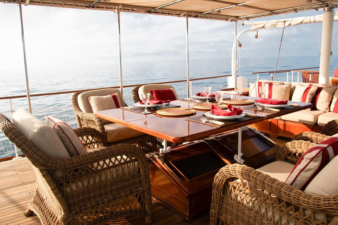 a table with chairs and a couch on it aboard LADY HERTHA Yacht for Sale