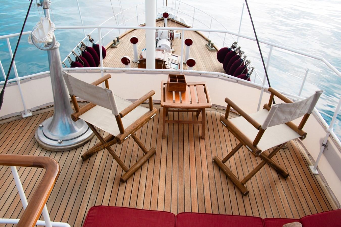 a boat with a group of chairs on it aboard LADY HERTHA Yacht for Sale