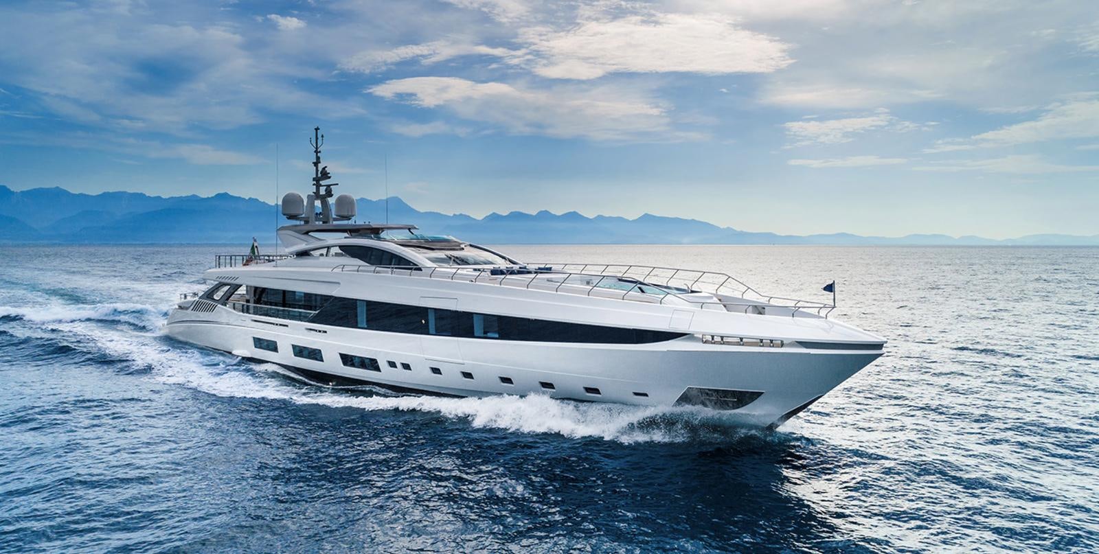 a white yacht in the water aboard GOLDENEYE Yacht for Sale