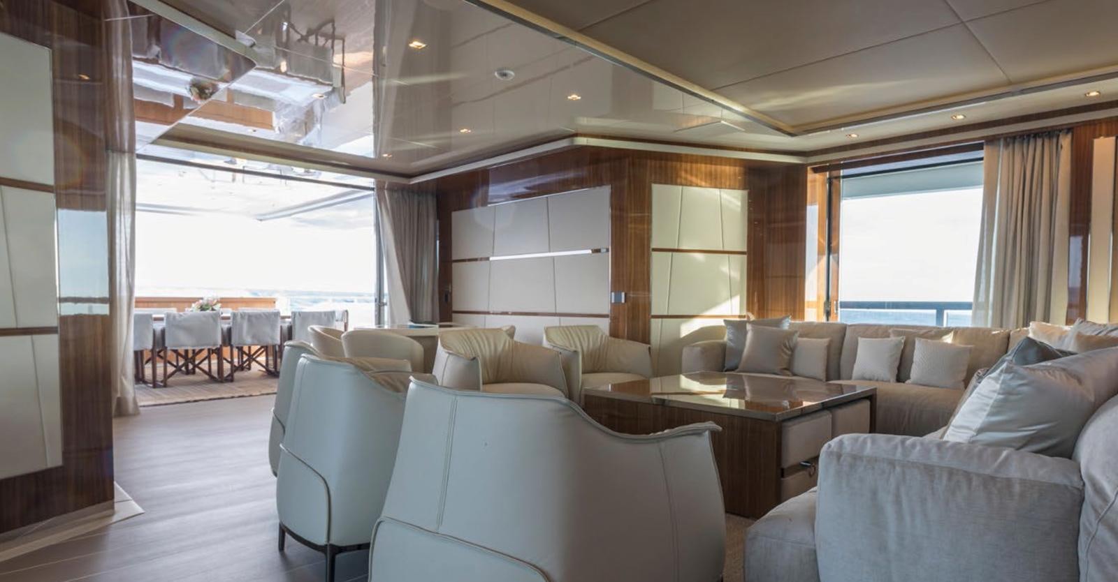 a living room with a large window aboard GOLDENEYE Yacht for Sale