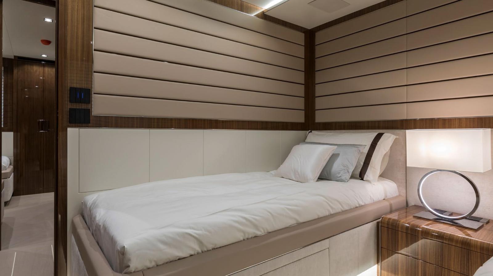 a bed with white sheets aboard GOLDENEYE Yacht for Sale