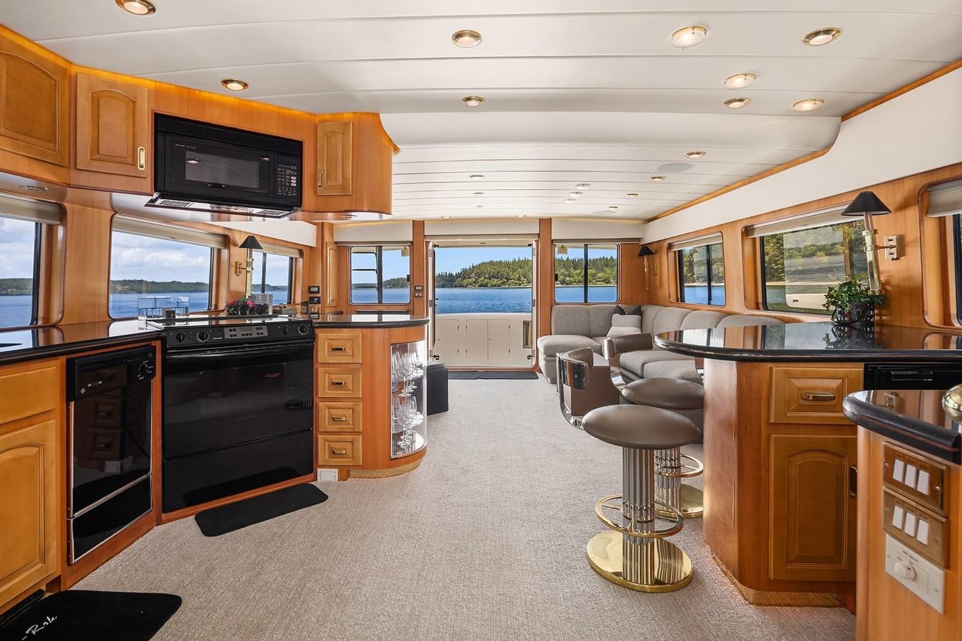 a kitchen with a stove and a bar aboard QUE SA-RAH SA-RAH Yacht for Sale