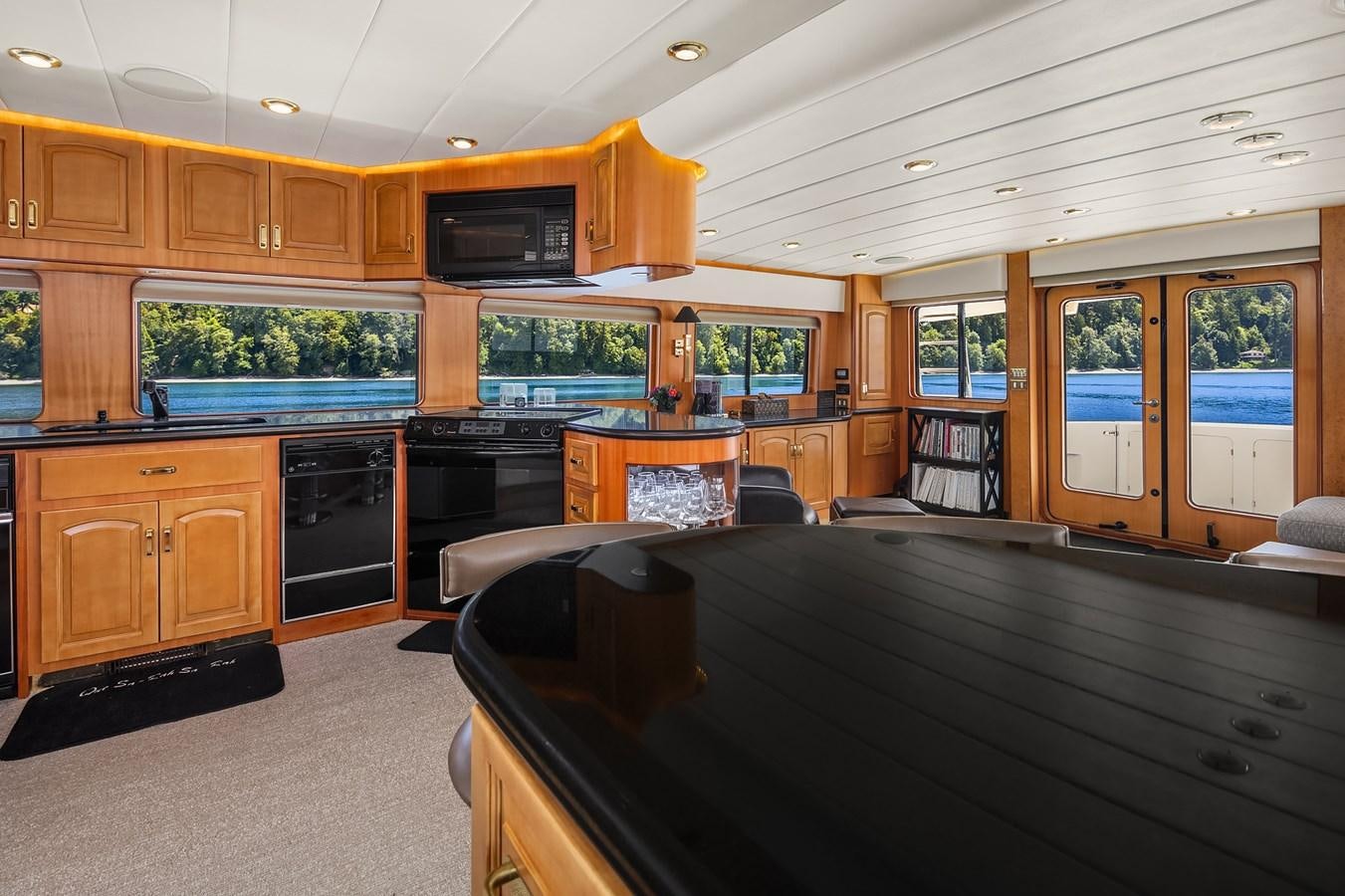 a kitchen with wooden cabinets aboard QUE SA-RAH SA-RAH Yacht for Sale