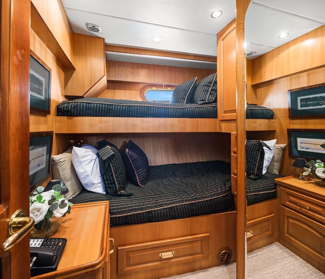 a bunk bed with a desk and a desk aboard QUE SA-RAH SA-RAH Yacht for Sale