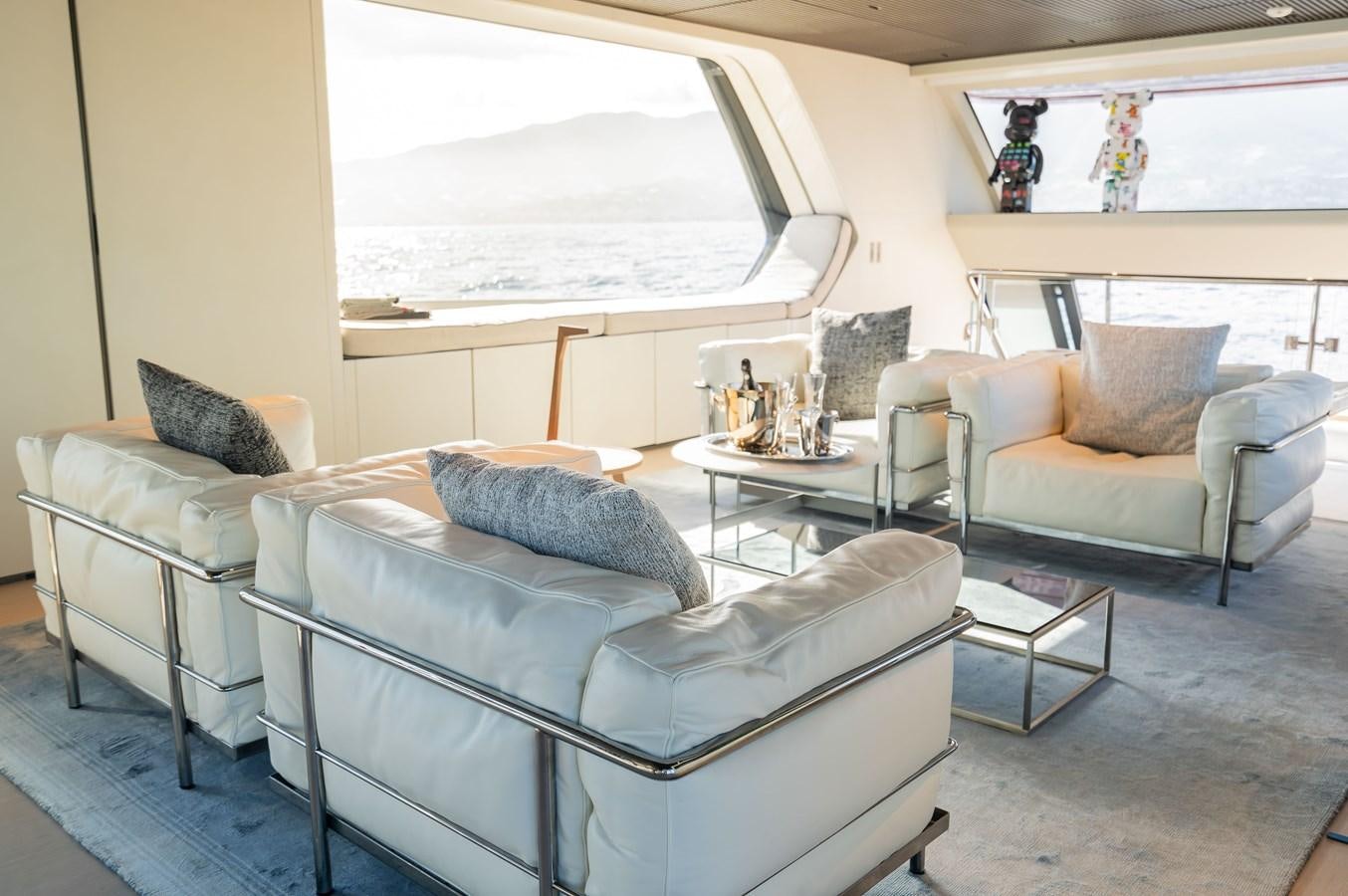a living room with a couch and a table aboard ANMAX Yacht for Sale