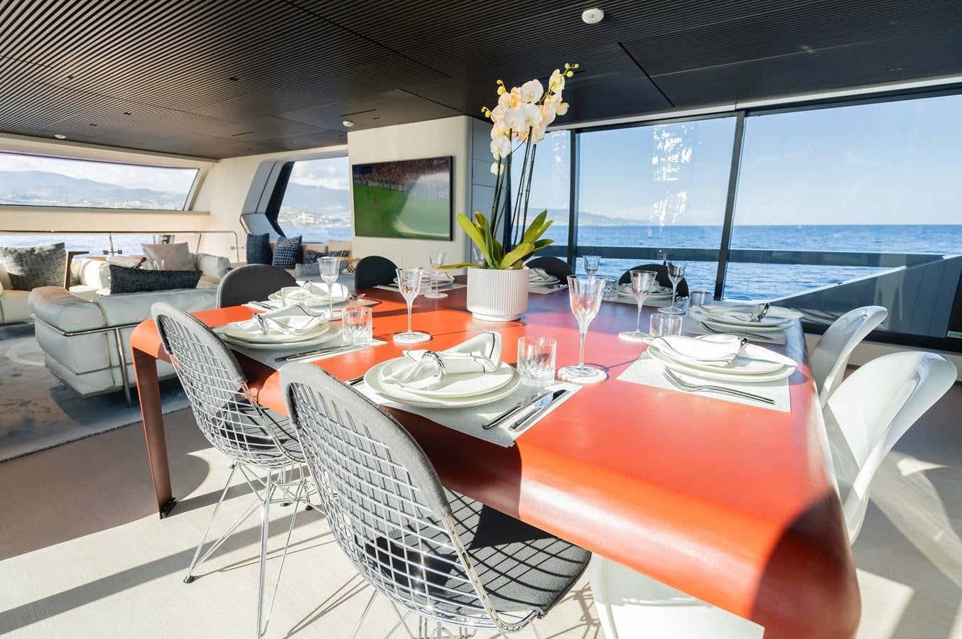 a table set with dinnerware aboard ANMAX Yacht for Sale