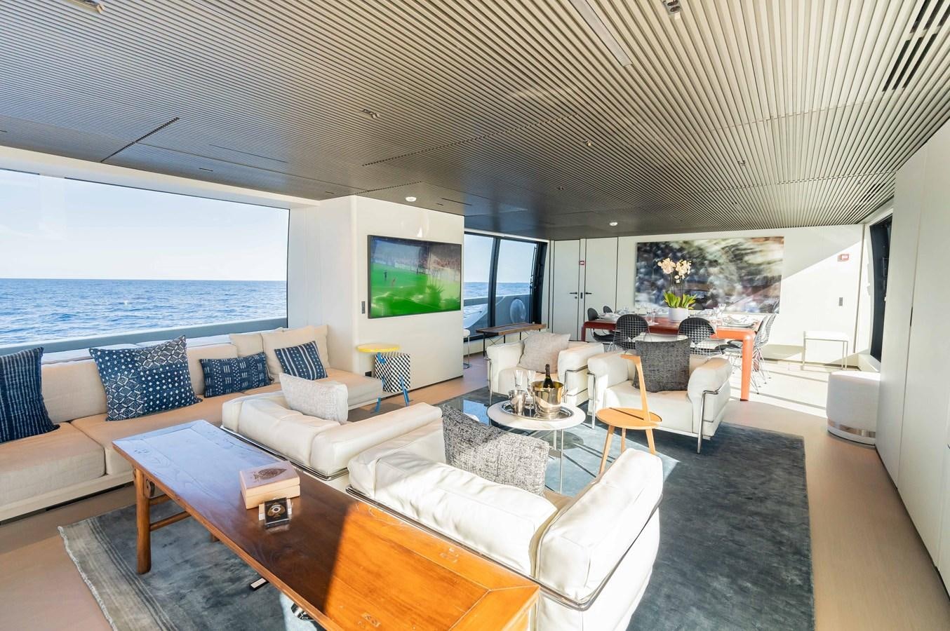 a living room with a large window aboard ANMAX Yacht for Sale
