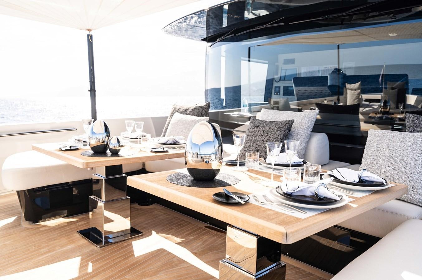 a modern living room with a large window aboard ANMAX Yacht for Sale