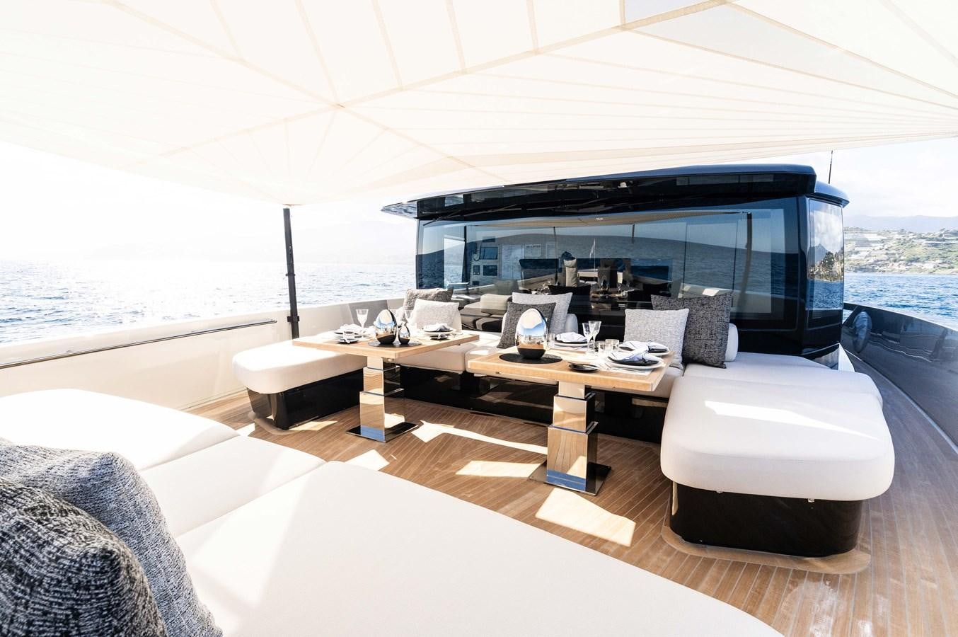 a room with a table and chairs aboard ANMAX Yacht for Sale