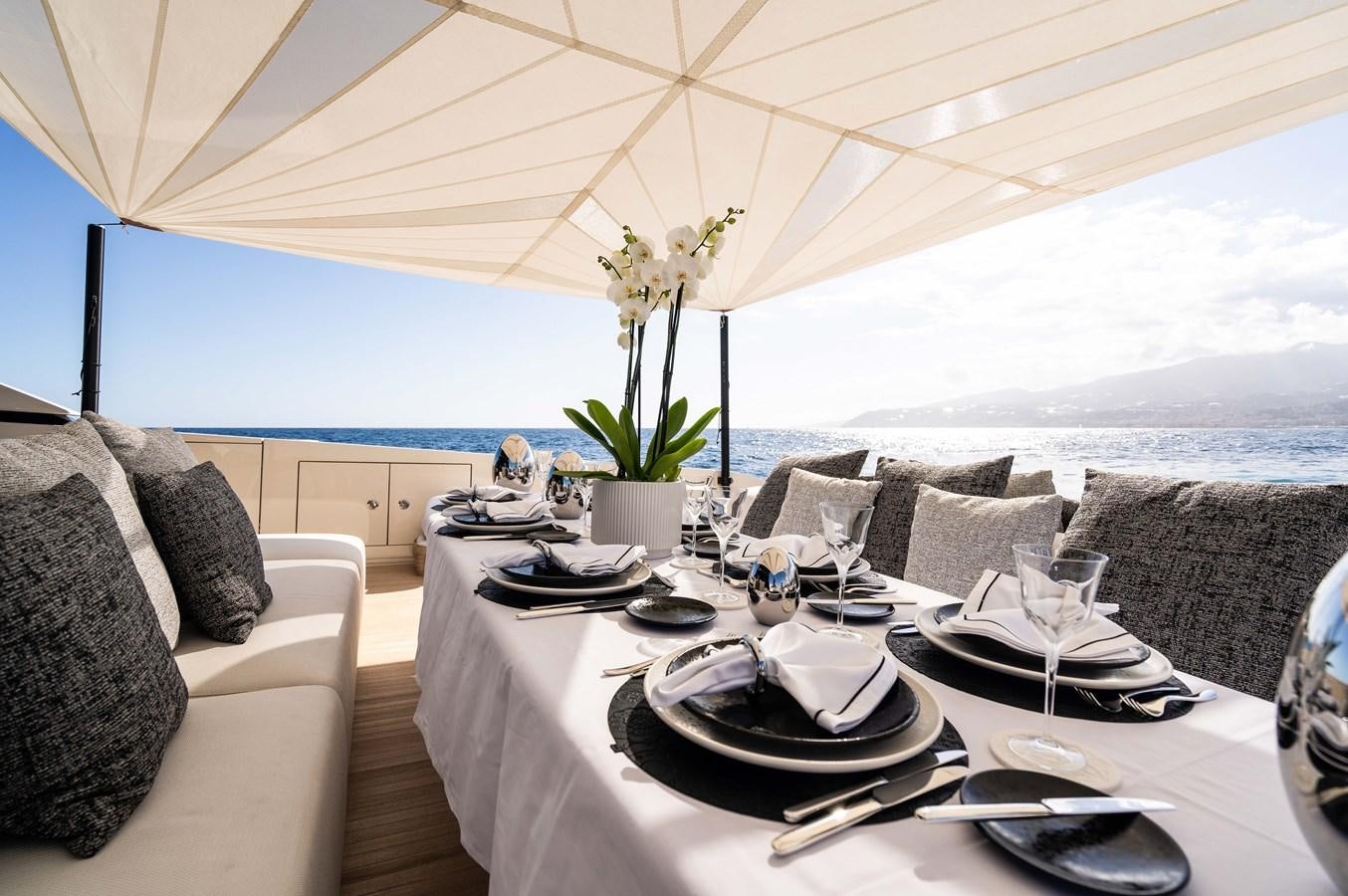 a table set for a meal aboard ANMAX Yacht for Sale