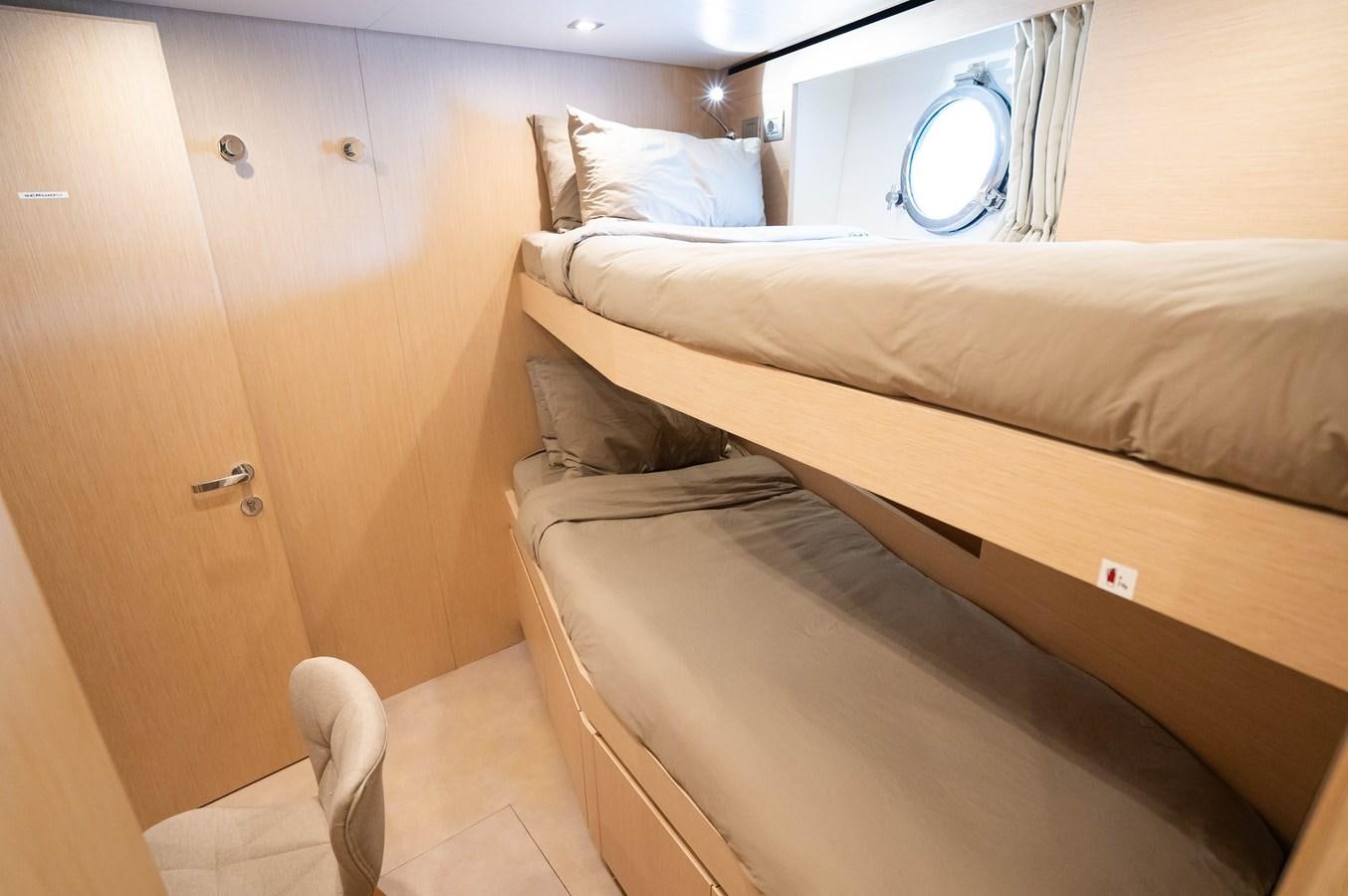 a bed in a room aboard ANMAX Yacht for Sale