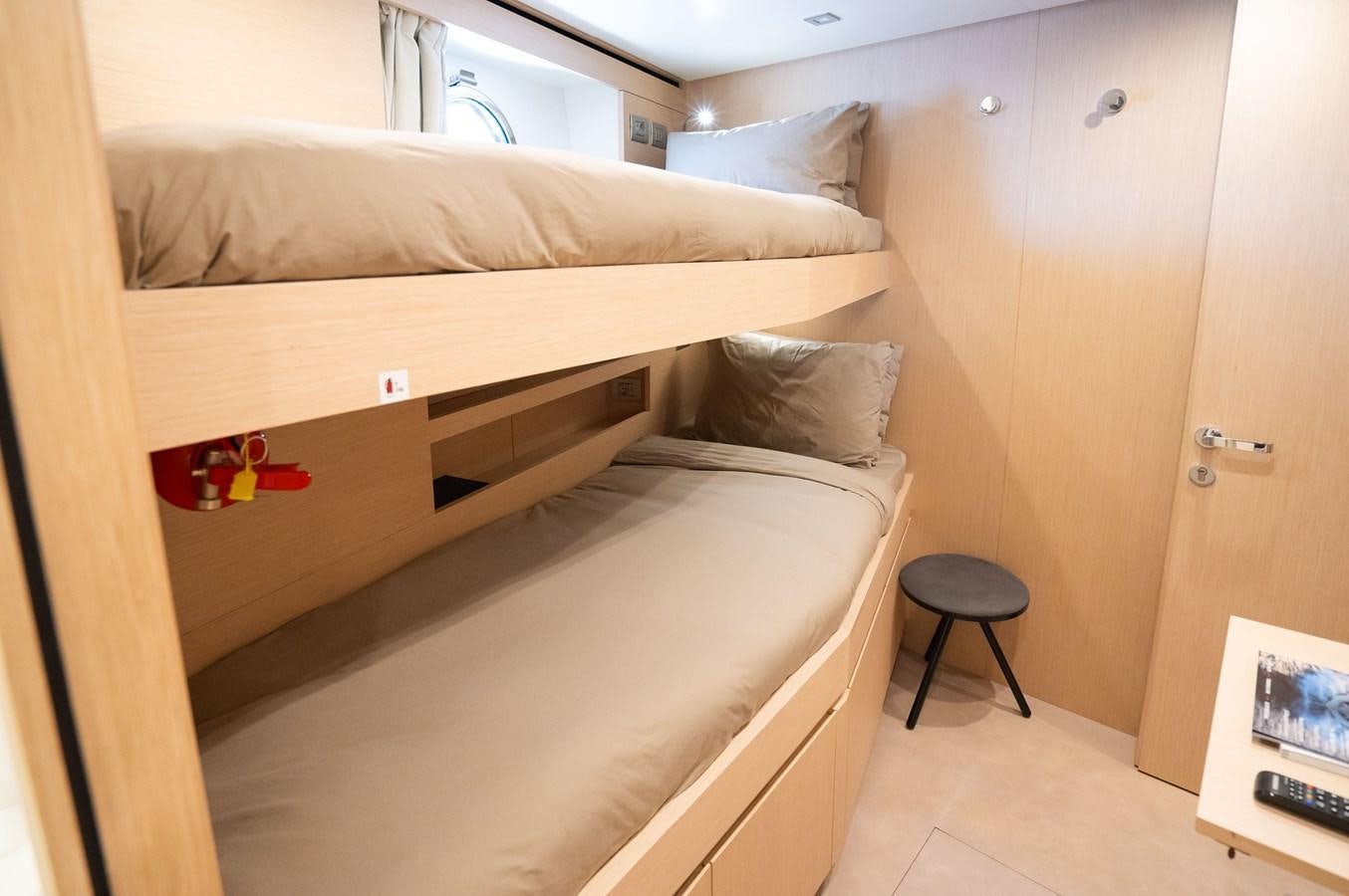a bed with a wooden frame aboard ANMAX Yacht for Sale