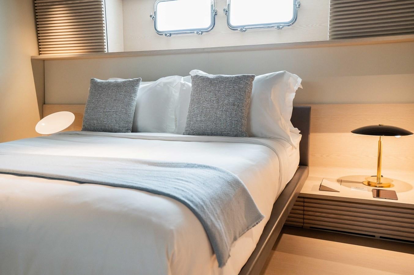 a bed with pillows aboard ANMAX Yacht for Sale