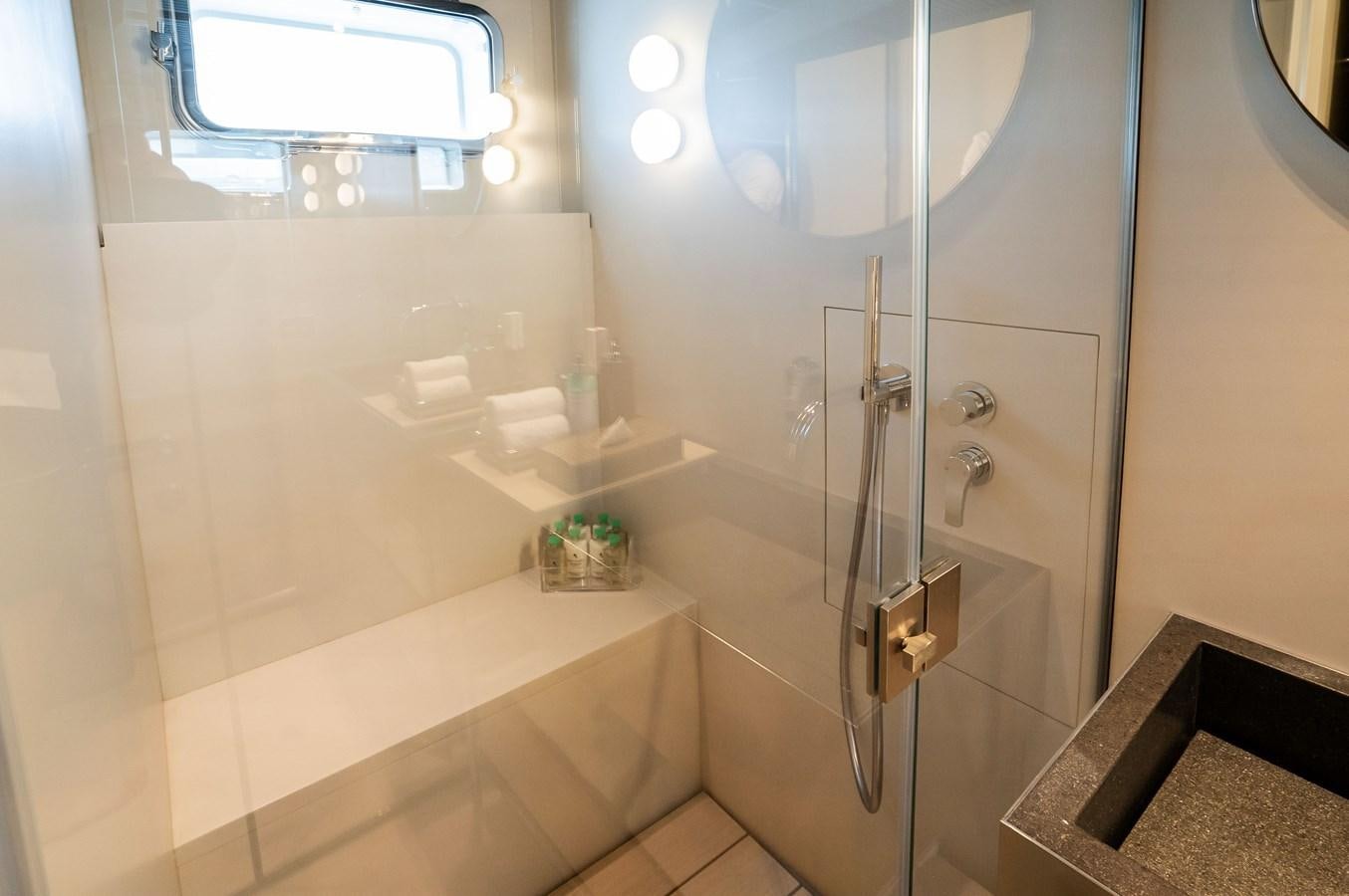 a shower with a glass door aboard ANMAX Yacht for Sale