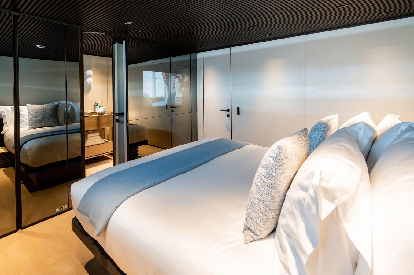 a bed in a room aboard ANMAX Yacht for Sale