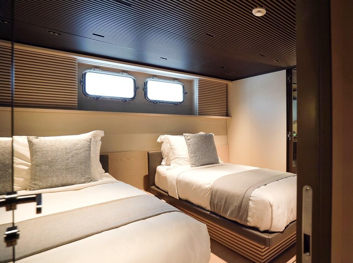 a couple of beds in a room aboard ANMAX Yacht for Sale