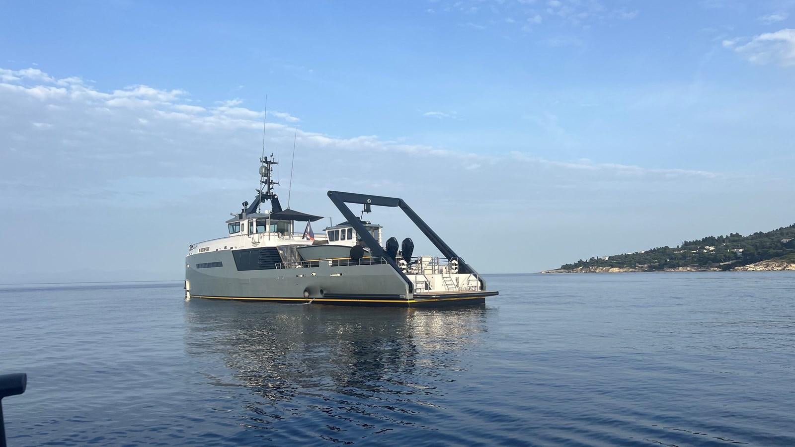 a boat in the water aboard NO DESTINATION Yacht for Sale