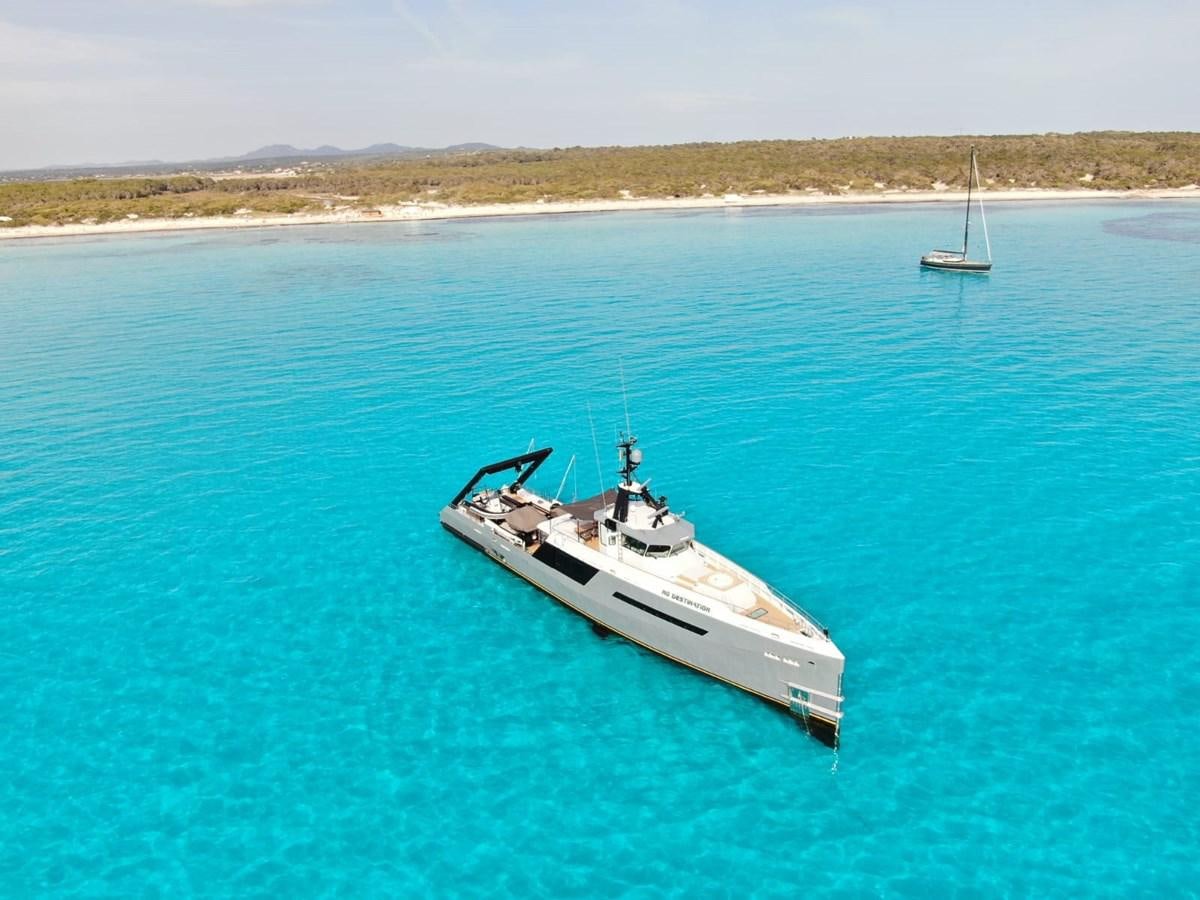 a boat in the water aboard NO DESTINATION Yacht for Sale