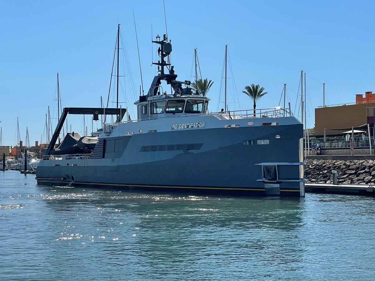 a boat in the water aboard NO DESTINATION Yacht for Sale
