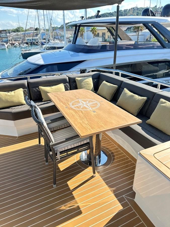 a table on a deck aboard NO DESTINATION Yacht for Sale