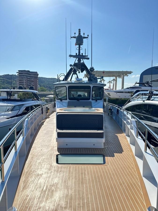 a boat on a dock aboard NO DESTINATION Yacht for Sale