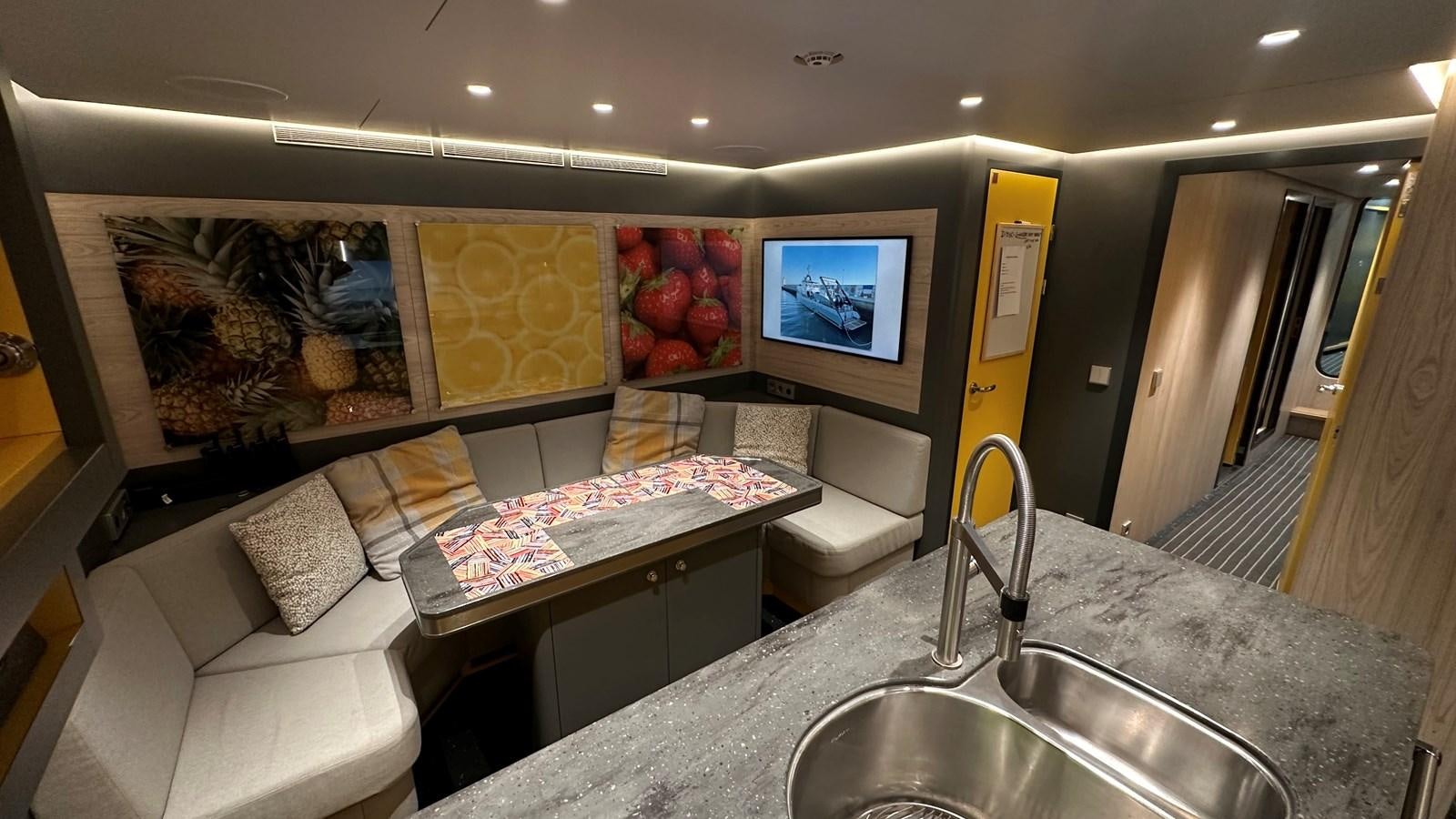 a kitchen with a large marble counter aboard NO DESTINATION Yacht for Sale
