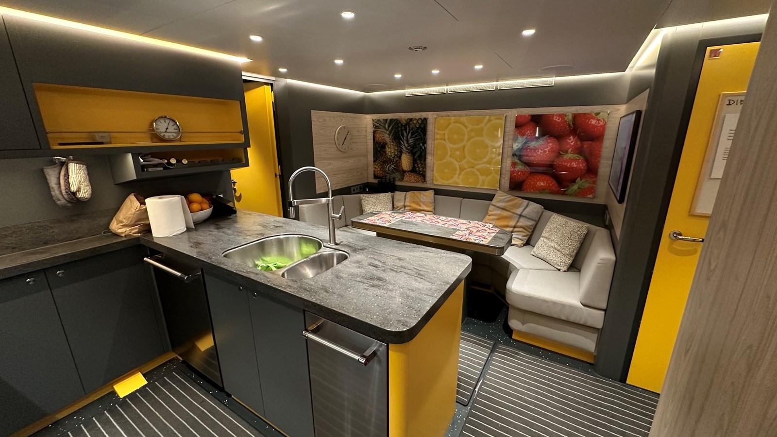 a kitchen with a sink and a counter aboard NO DESTINATION Yacht for Sale